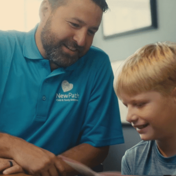 Child Psychiatrist with child getting education on psychiatric medication